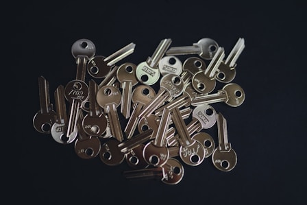 a pile of keys sitting on top of a table