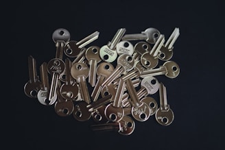 A set of shiny flip keys displayed on a dark surface.