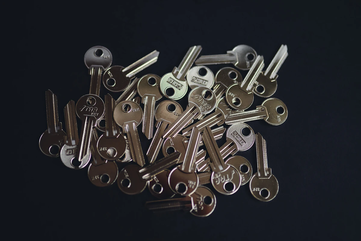 A pile of keys sitting on top of a table