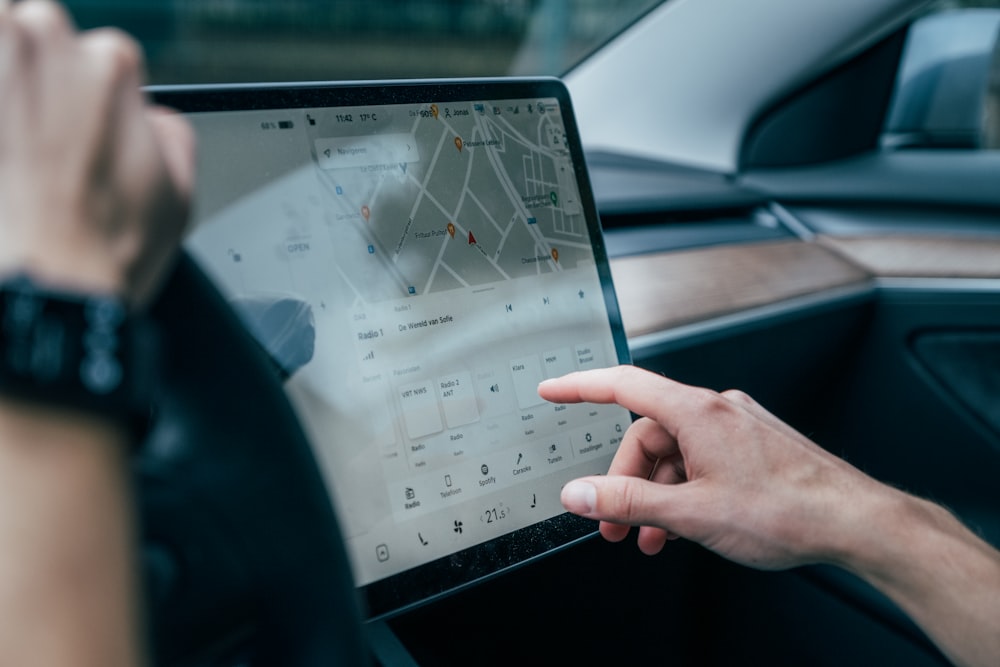 a person using a laptop in a car