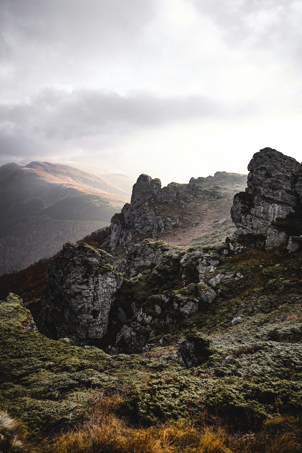 a person standing on top of a rocky hill