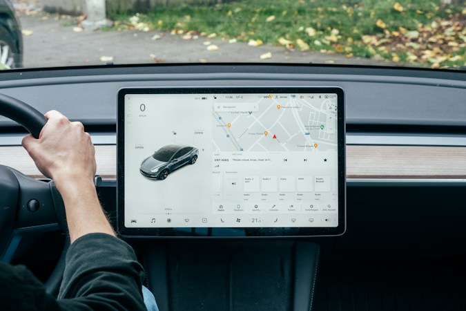 A vehicle dashboard display showing a live road map, similar to the navigation systems used in autonomous cars