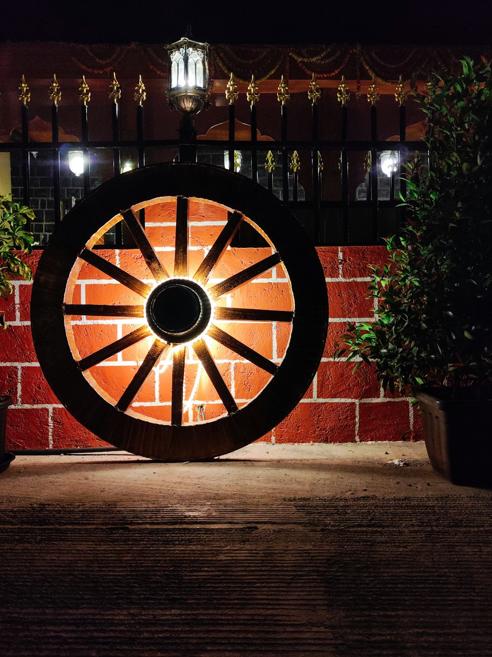 a wagon wheel sitting on top of a wooden floor