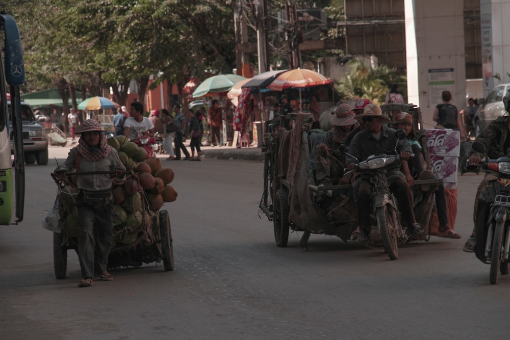 a group of people riding on the back of a motorcycle