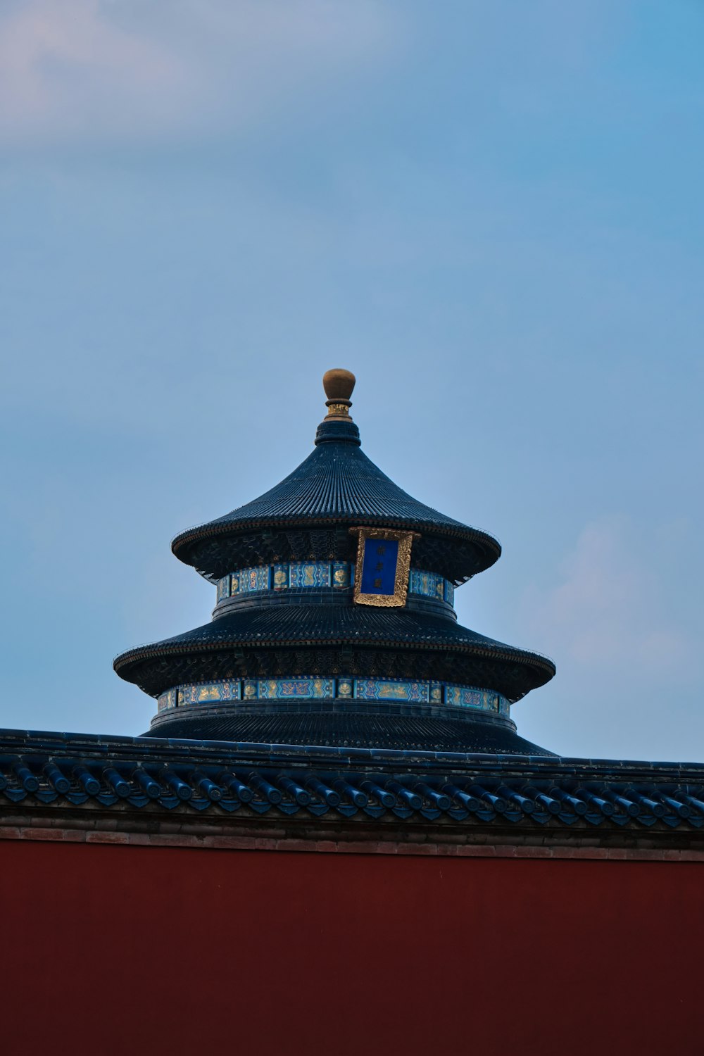 a tall building with a sky background