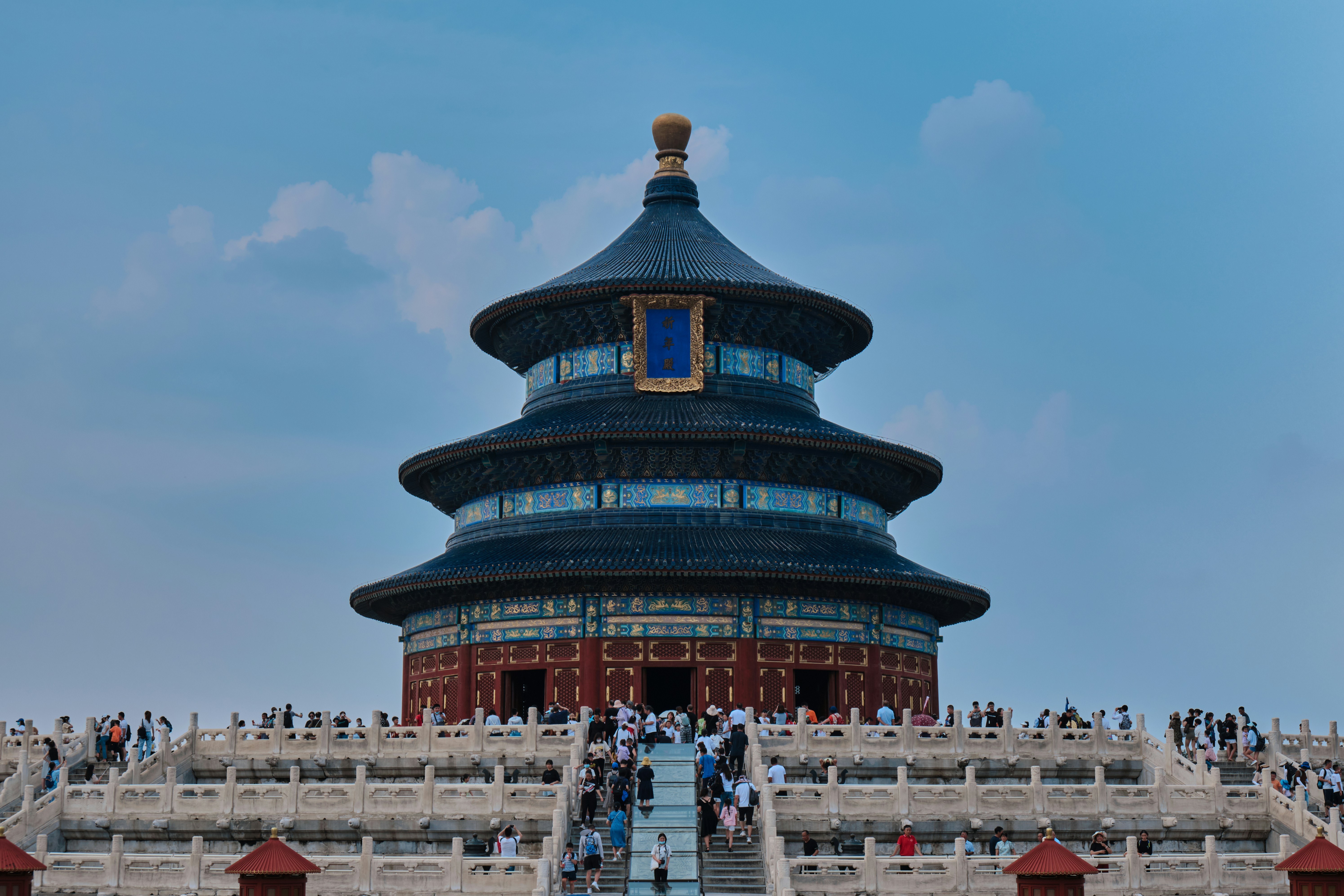 a group of people walking up and down a set of stairs