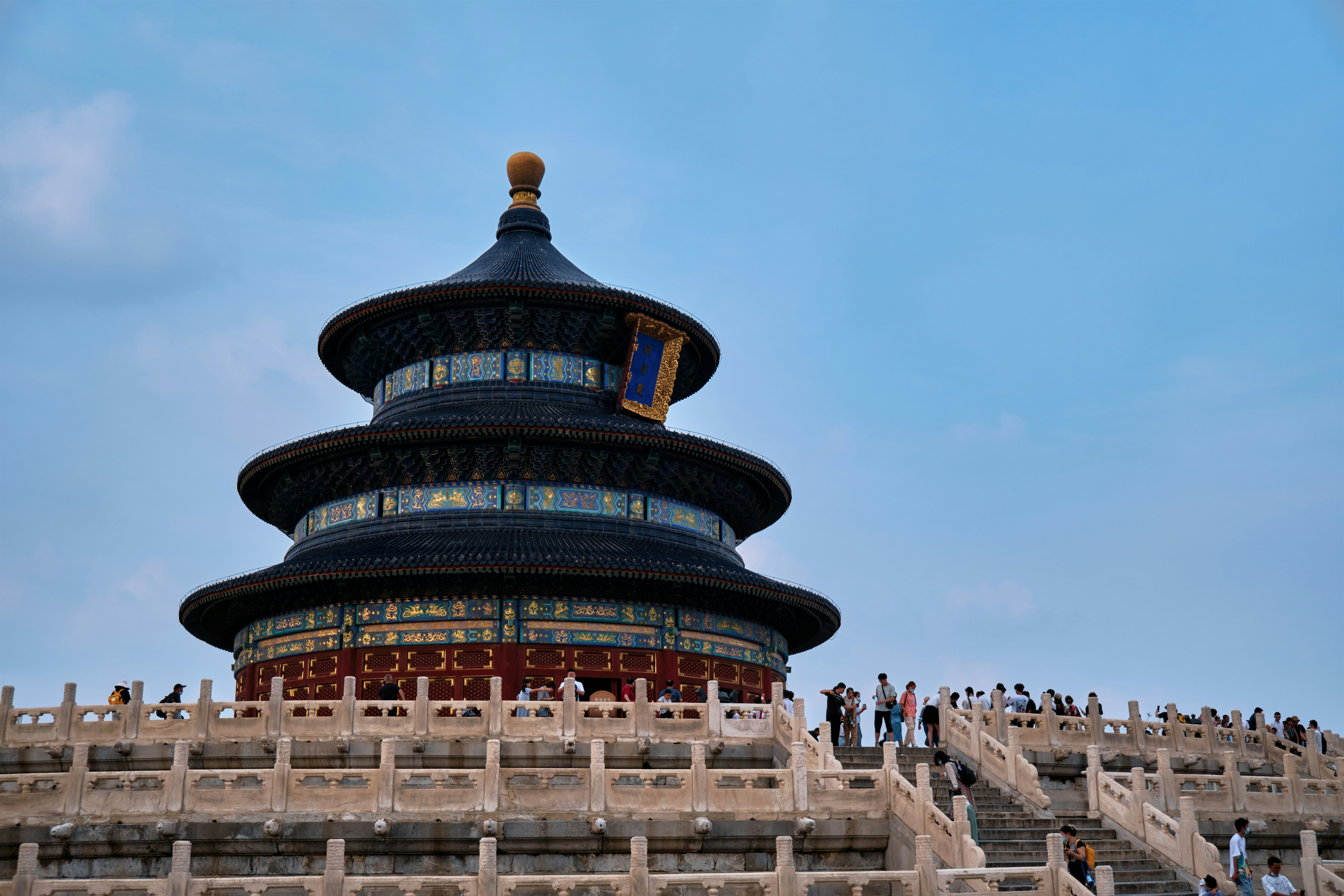 a group of people standing on top of a building