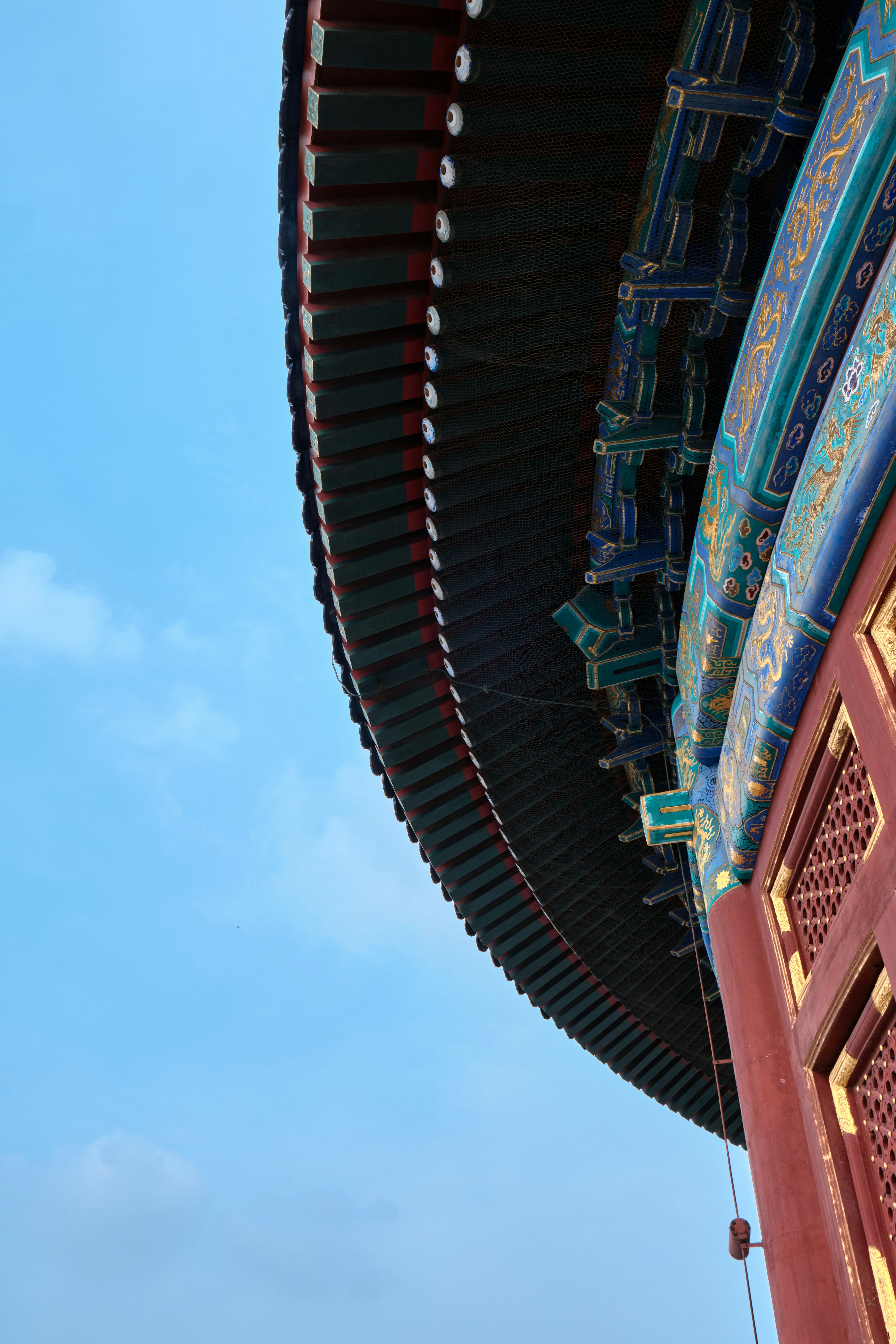 a tall building with a blue sky in the background