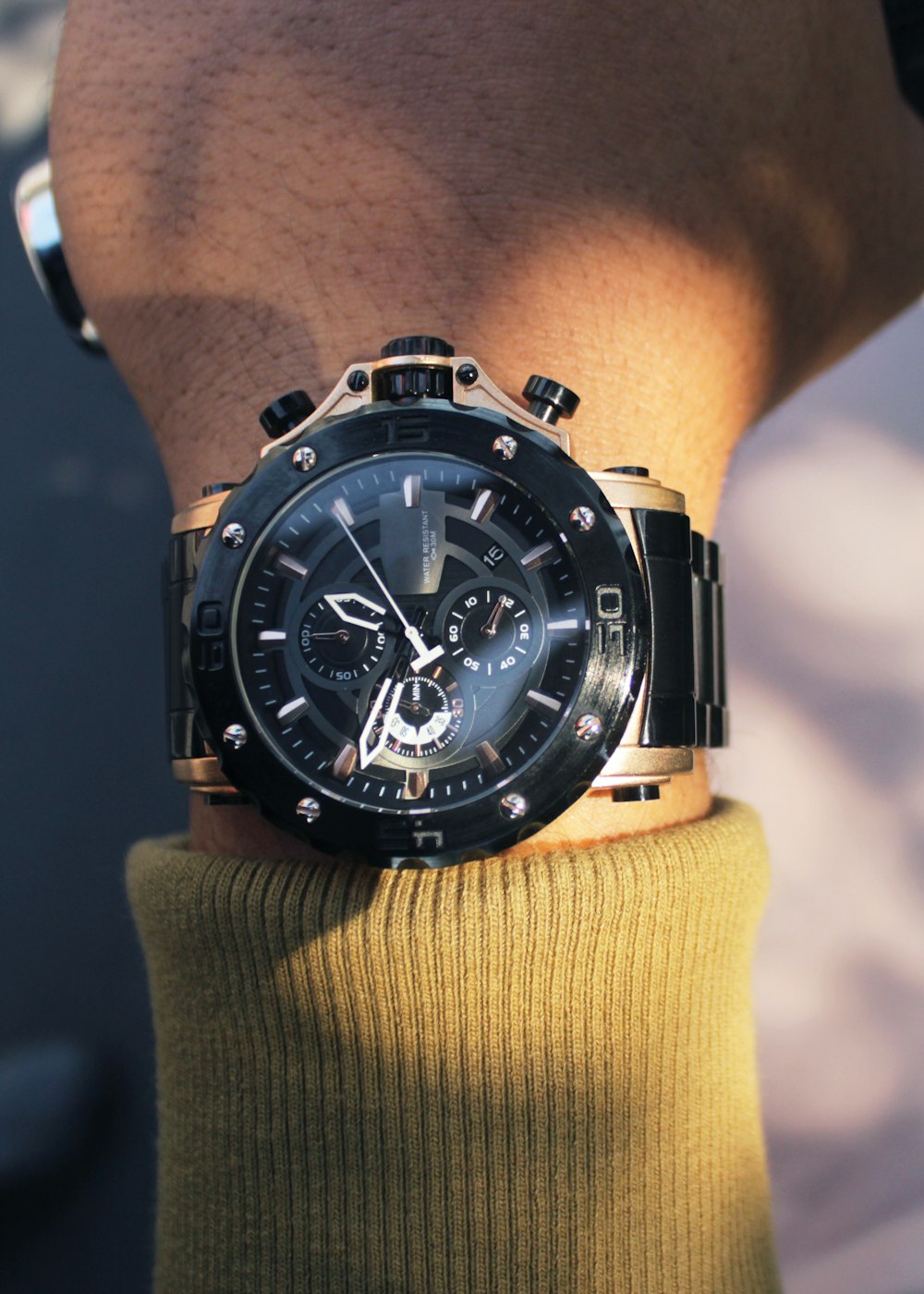 a close up of a person wearing a watch