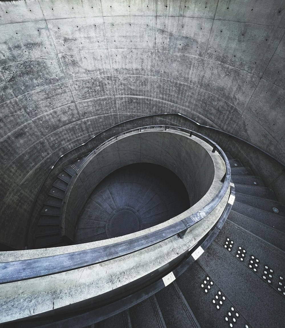 a spiral staircase in a concrete building