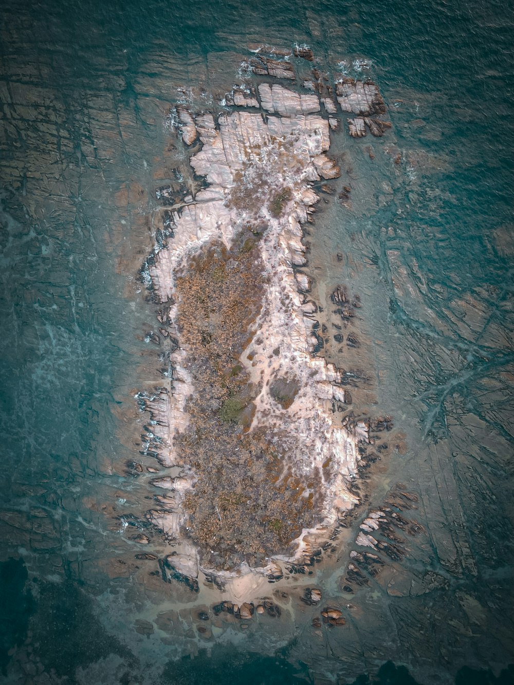 an aerial view of an island in the ocean