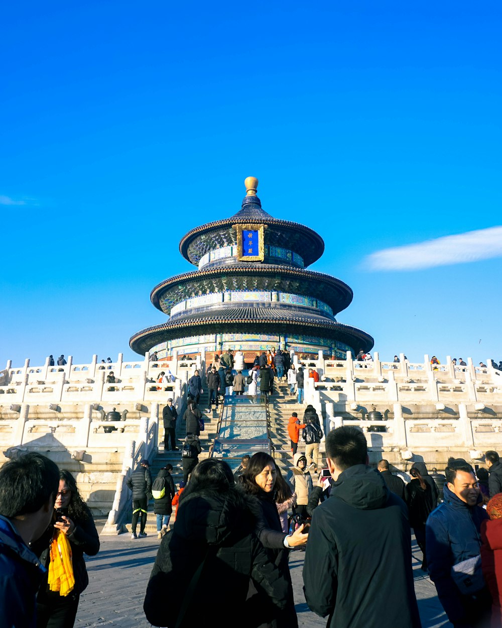 a group of people standing in front of a building