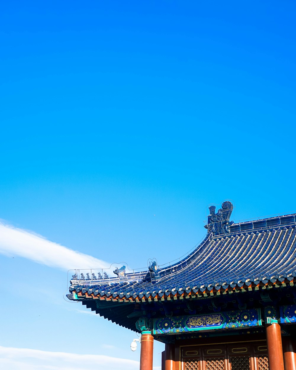 a tall building with a blue sky in the background