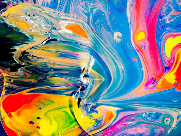 A vibrant splash of colorful paint swirling in a playful pattern.