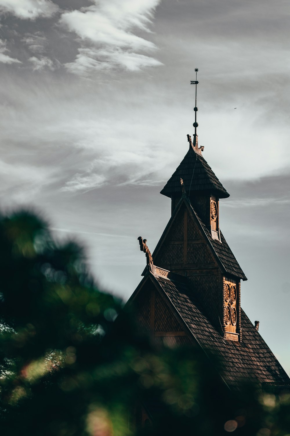 a black and white photo of a church steeple