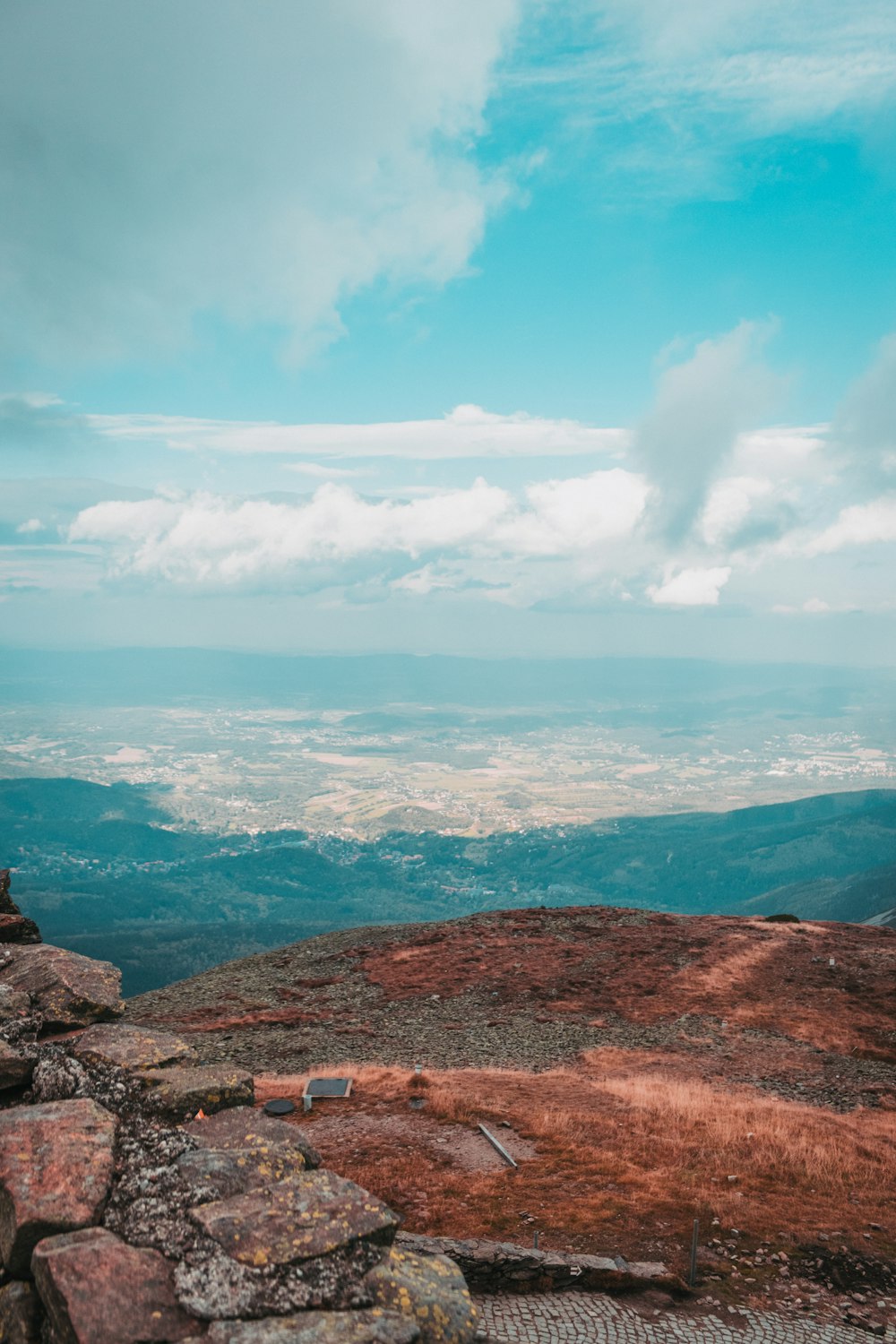 a person standing on top of a rocky hill