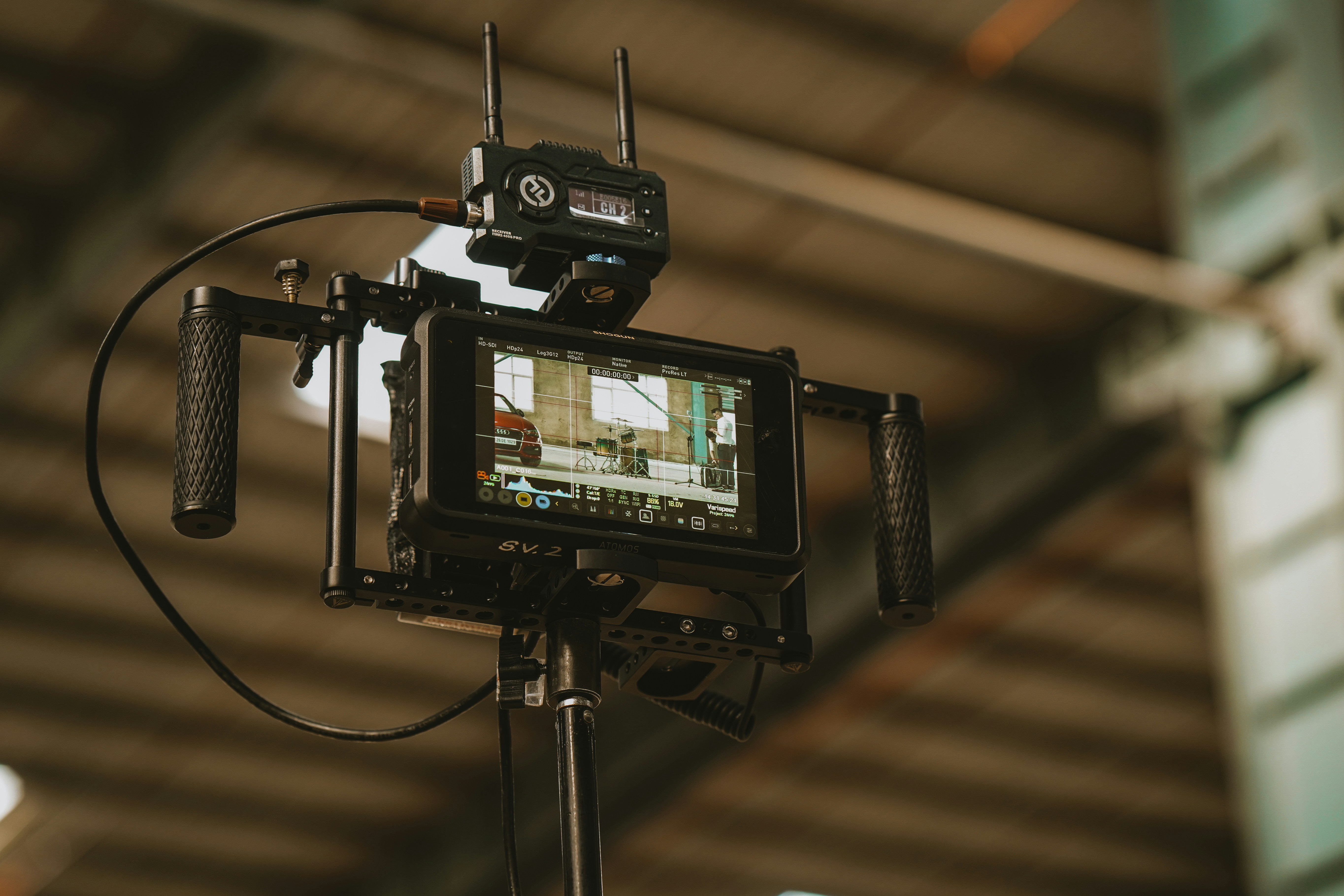 a video camera set up in a warehouse, Atomos Shogun Monitor