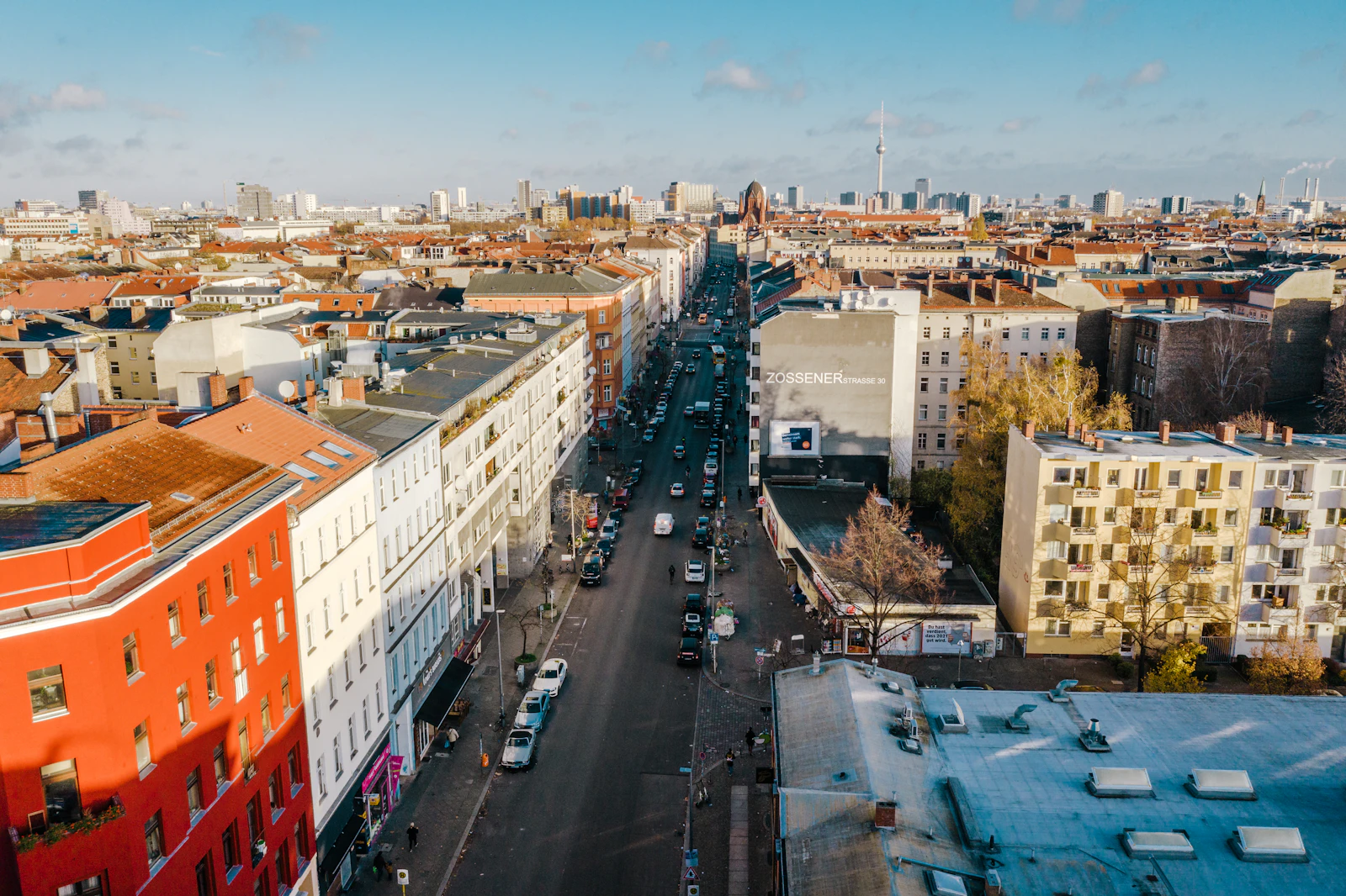 Travel photograph: Zossener Strasse runs through the rooftops of Kreuzberg's Bergmannkiez toward Berlin's distant Fernsehturm.