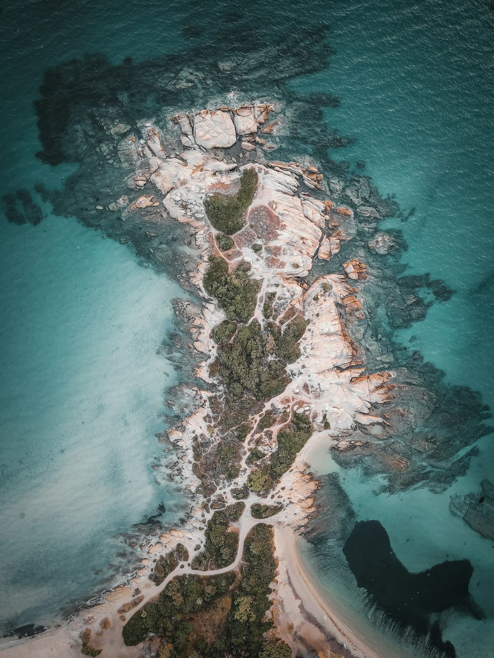 an aerial view of a beach and a body of water