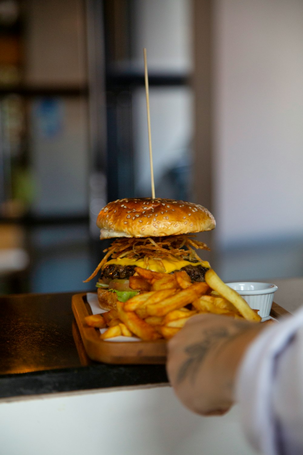 a hamburger and french fries on a tray