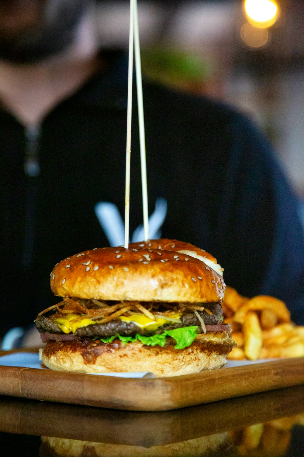 a hamburger with a toothpick sticking out of it