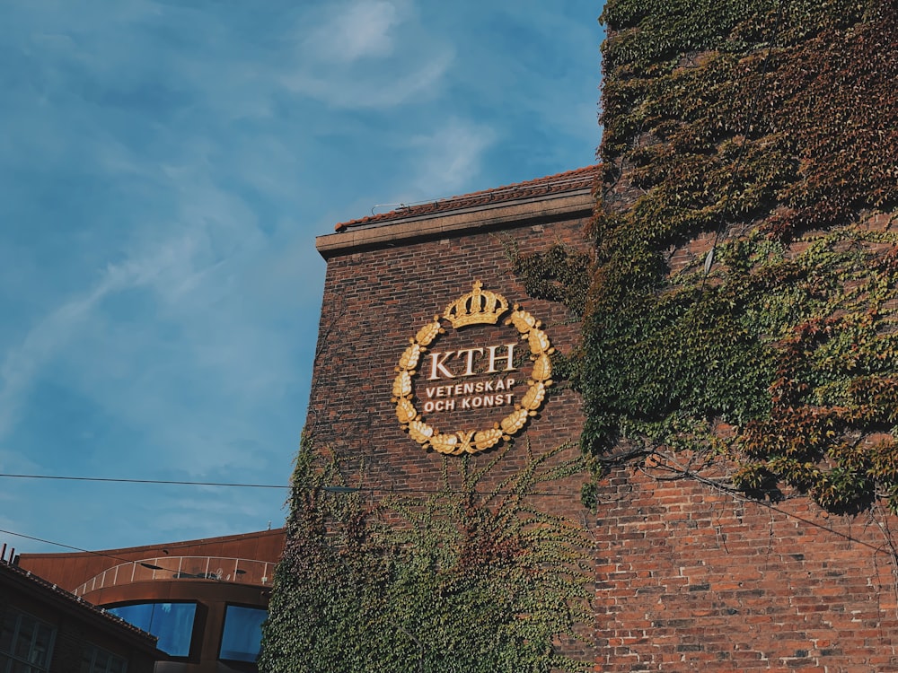 a brick building with ivy growing up the side of it