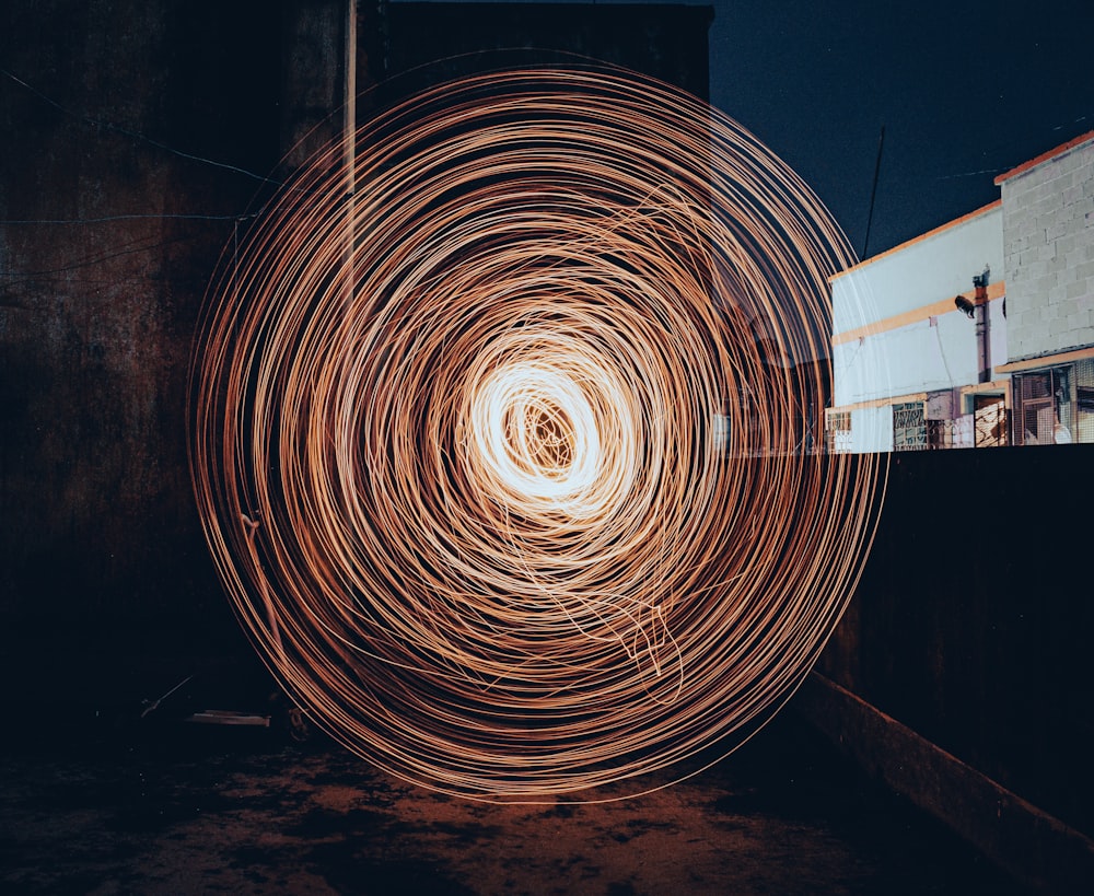 a spiral of metal wire in front of a building