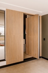 a room that has a wooden door in it