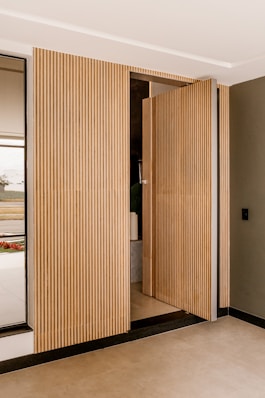 a room that has a wooden door in it