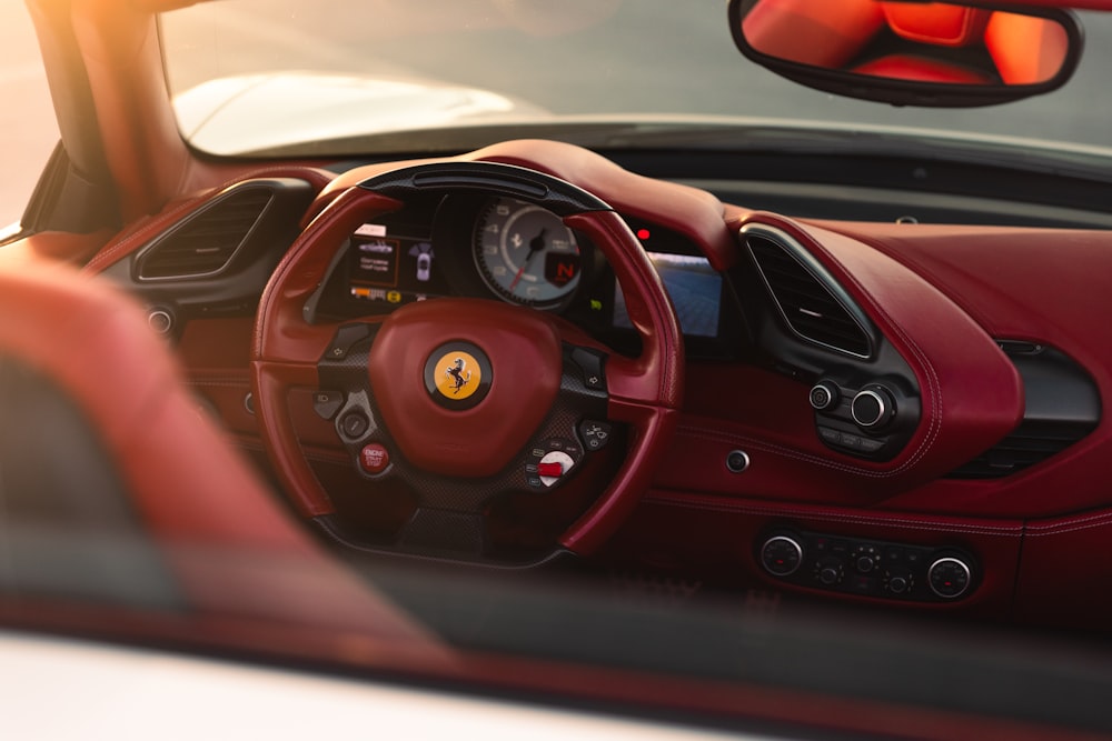 the interior of a red sports car