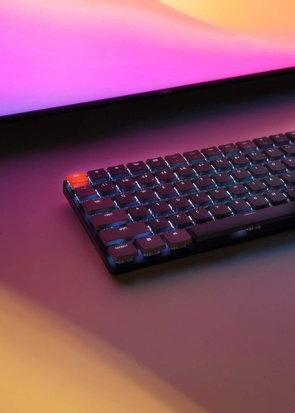 a black keyboard sitting on top of a table