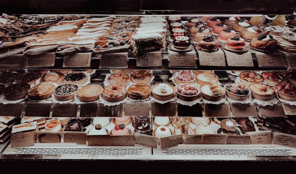 a display case filled with lots of different types of pastries