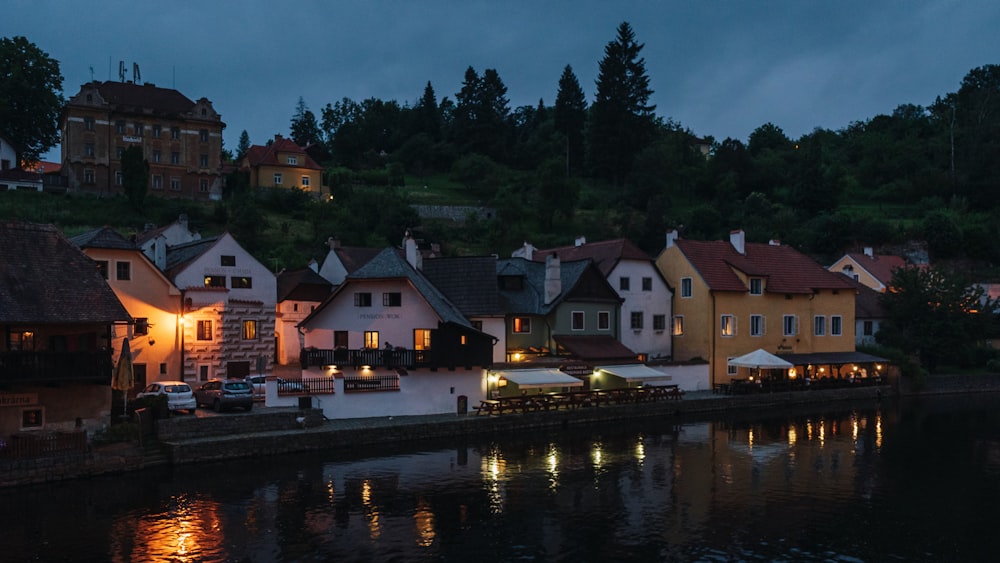 a row of houses next to a body of water