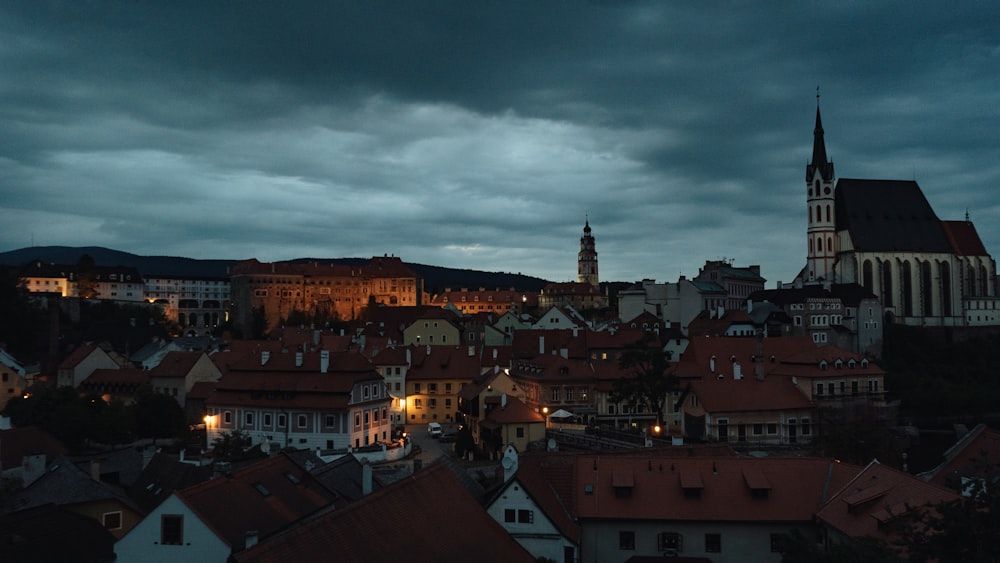 a view of a city at night from a hill