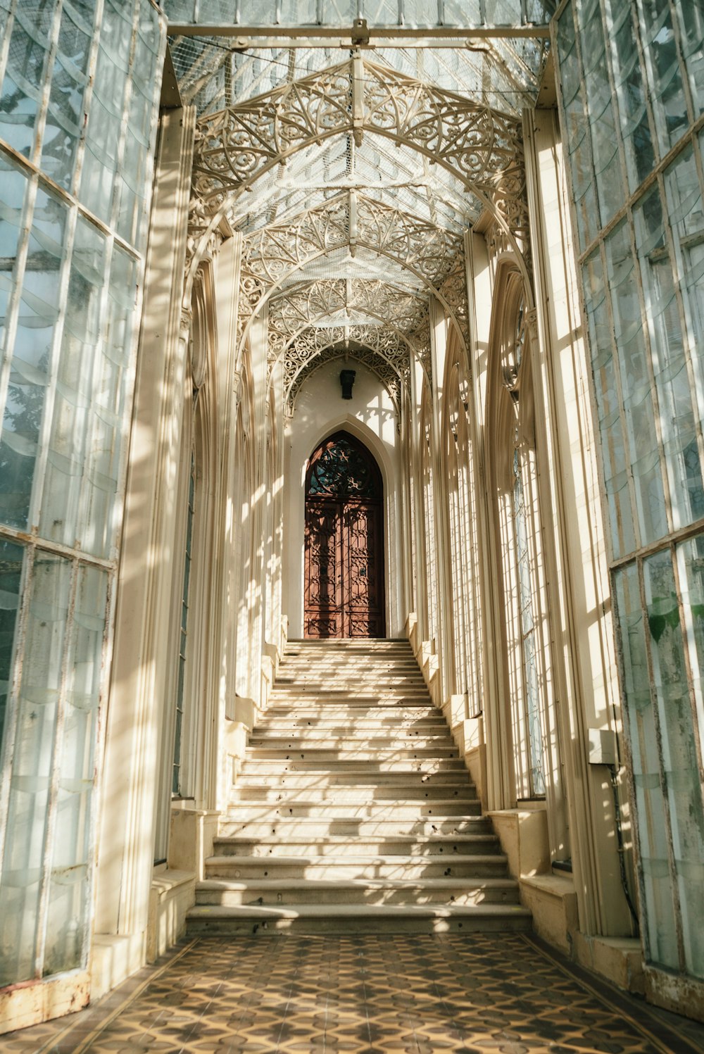 a very long hallway with a lot of windows