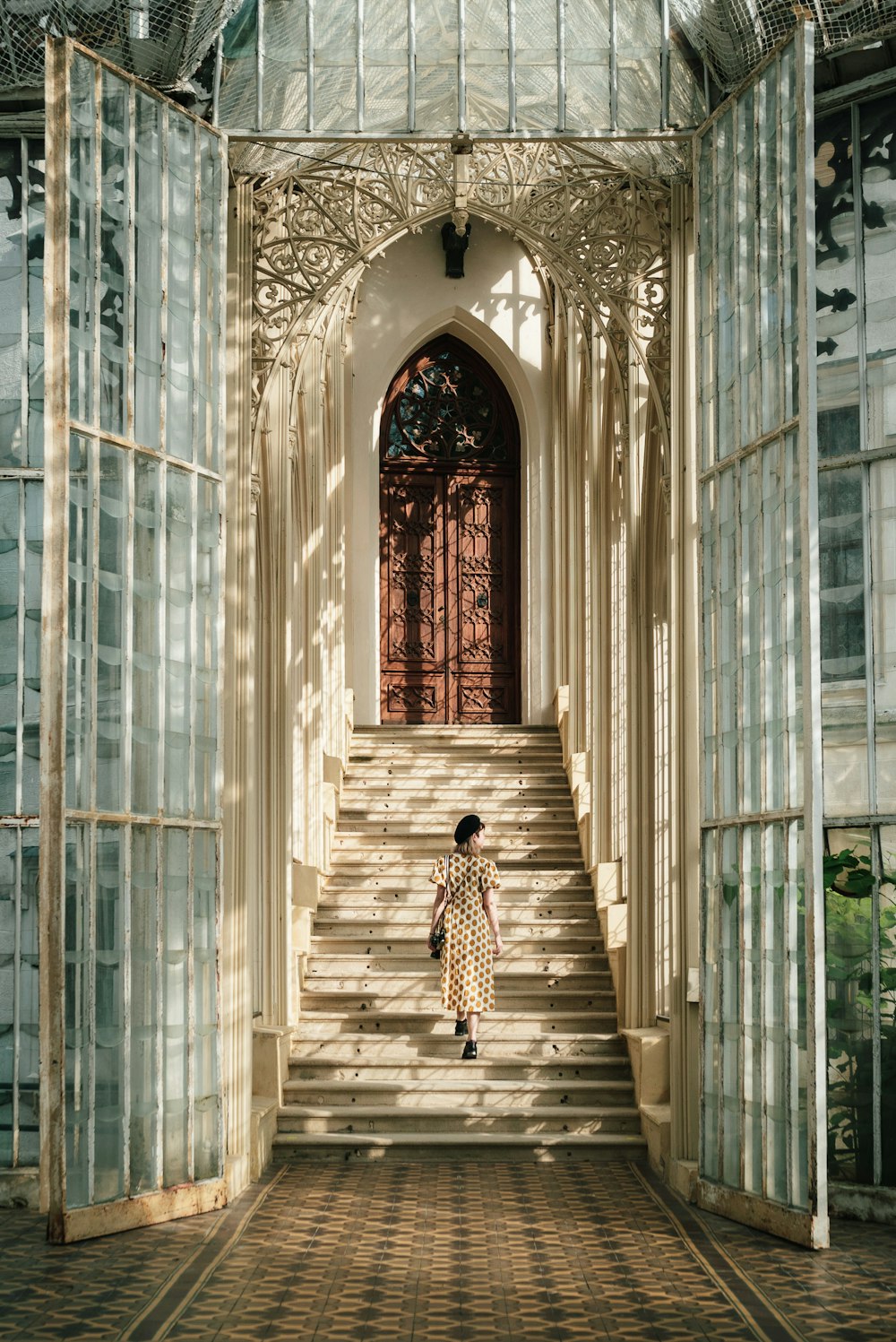 a woman walking down a set of stairs