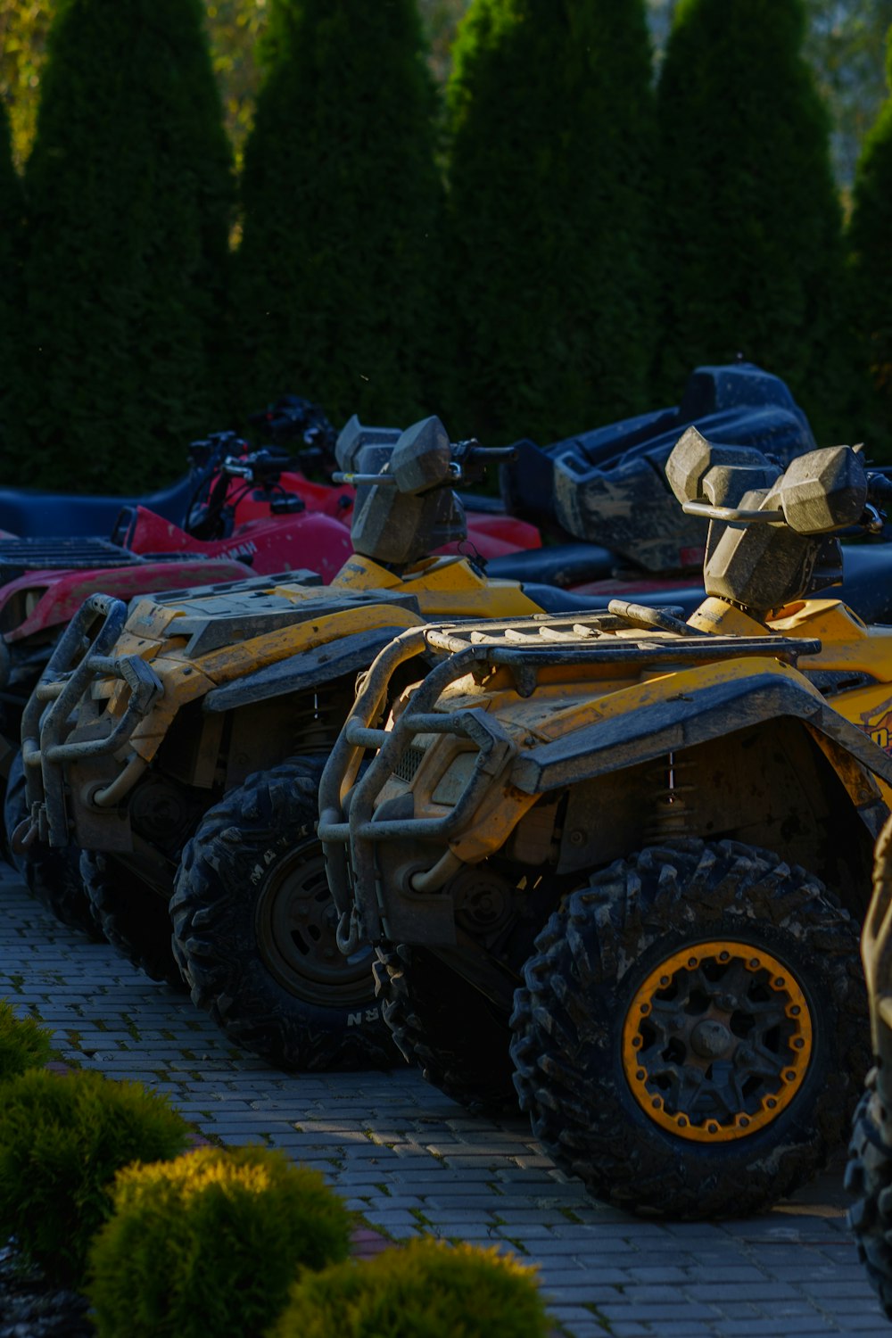a row of four wheelers parked next to each other