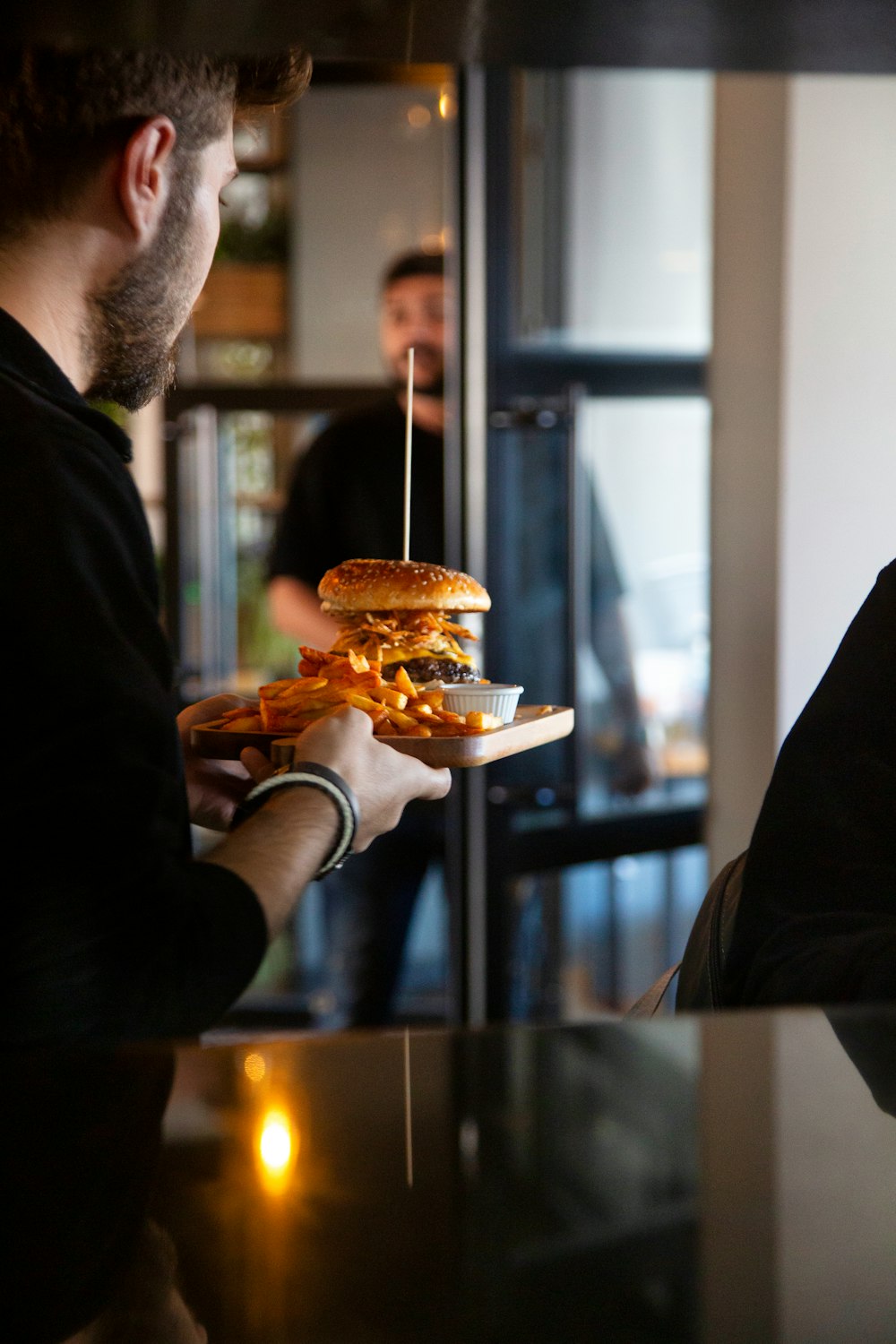 a man holding a large sandwich in his hand