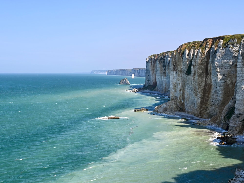 a view of the cliffs and the ocean from a cliff