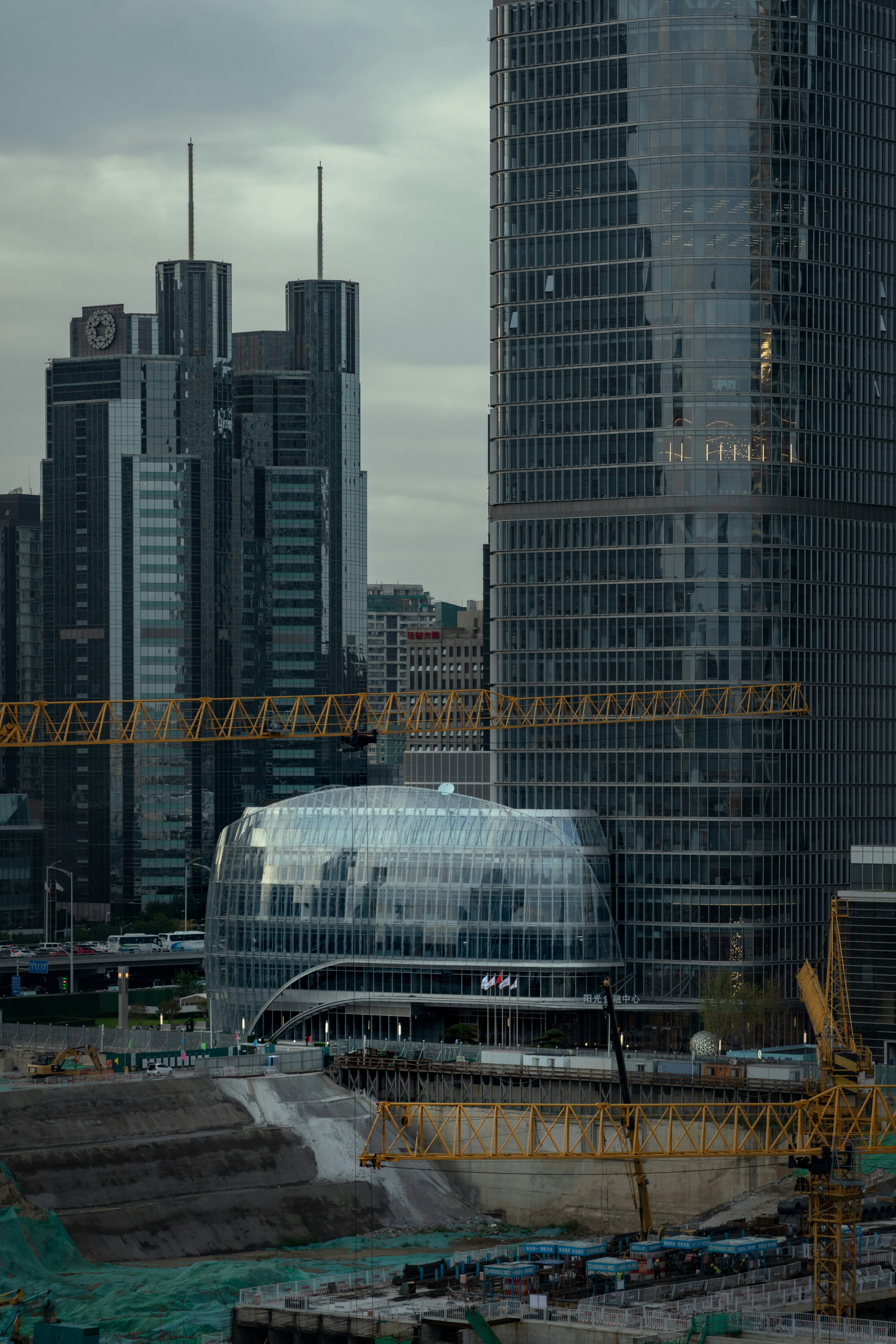 a large building with a crane in front of it