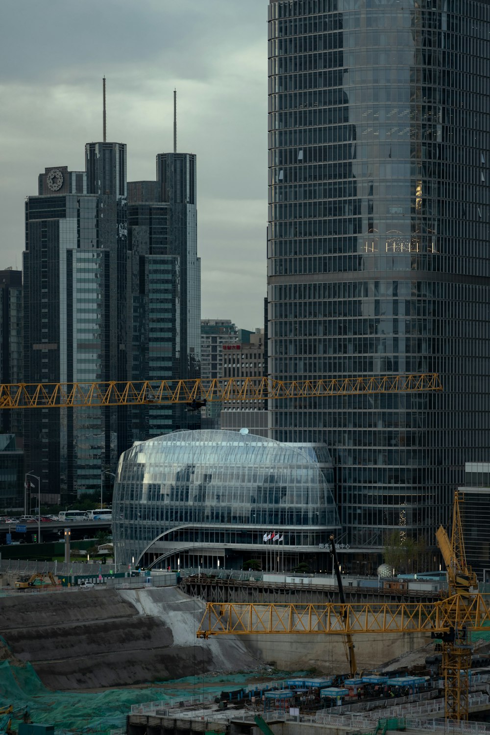 a large building with a crane in front of it