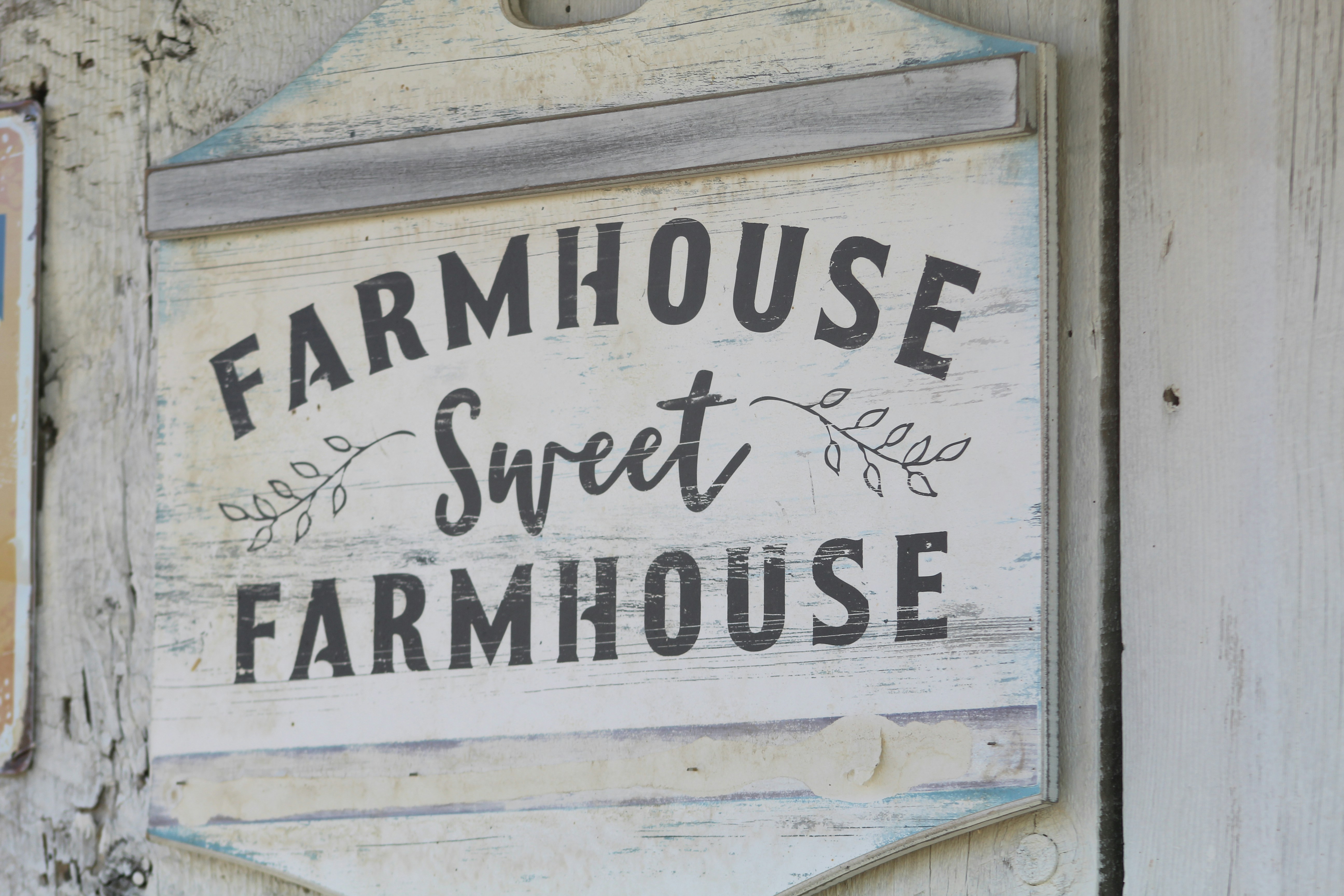 Farmhouse sign on building