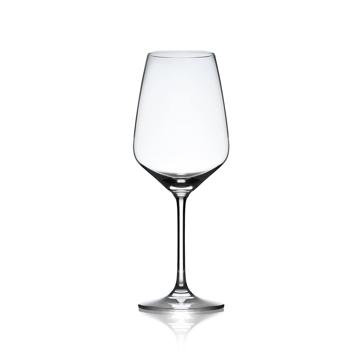 A tall clear wine glass with a fine stem standing on white