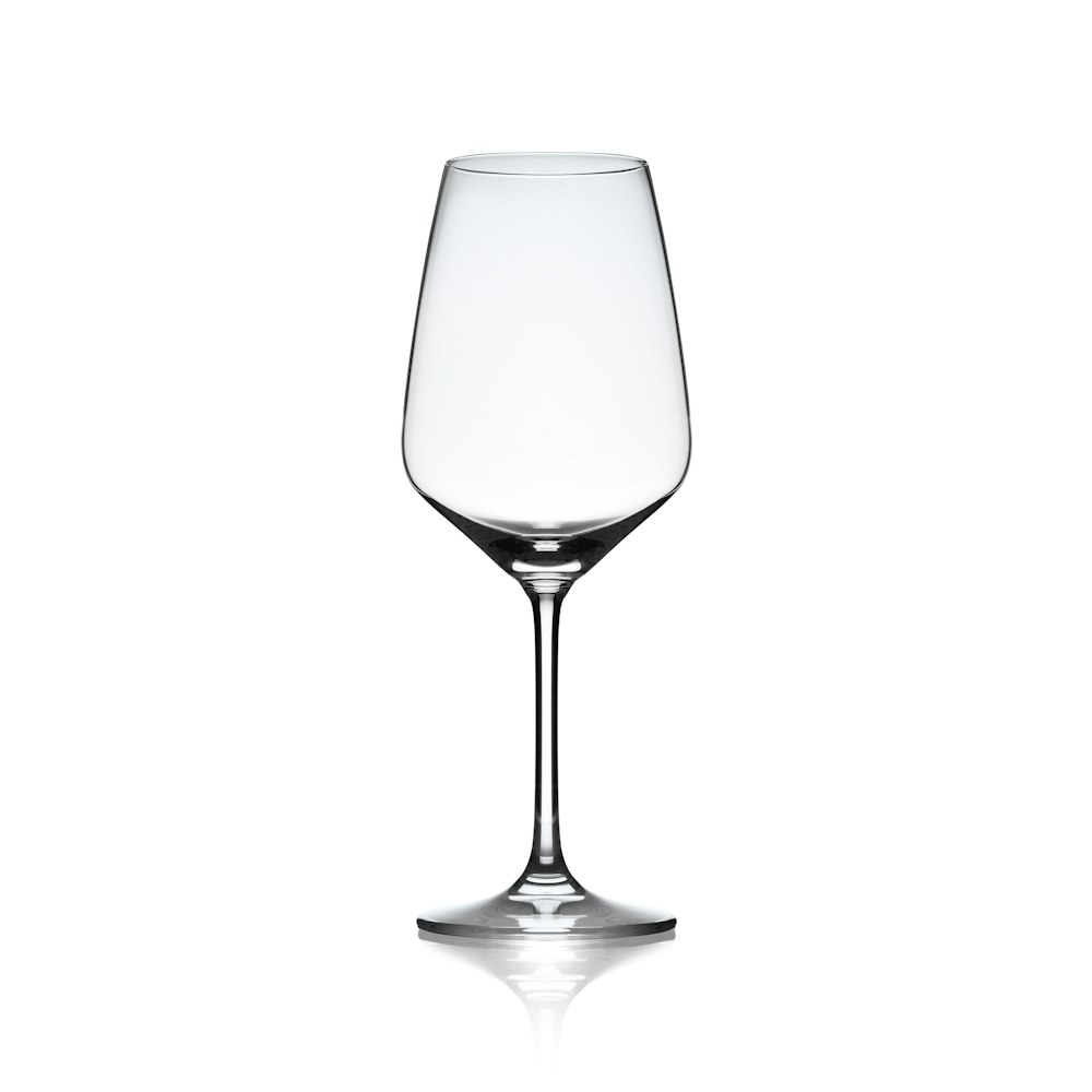 a clear wine glass on a white background