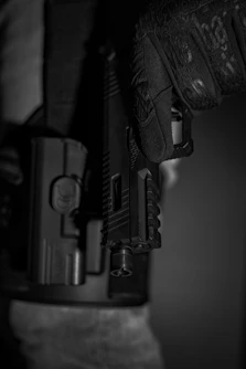 a close up of a person holding a gun