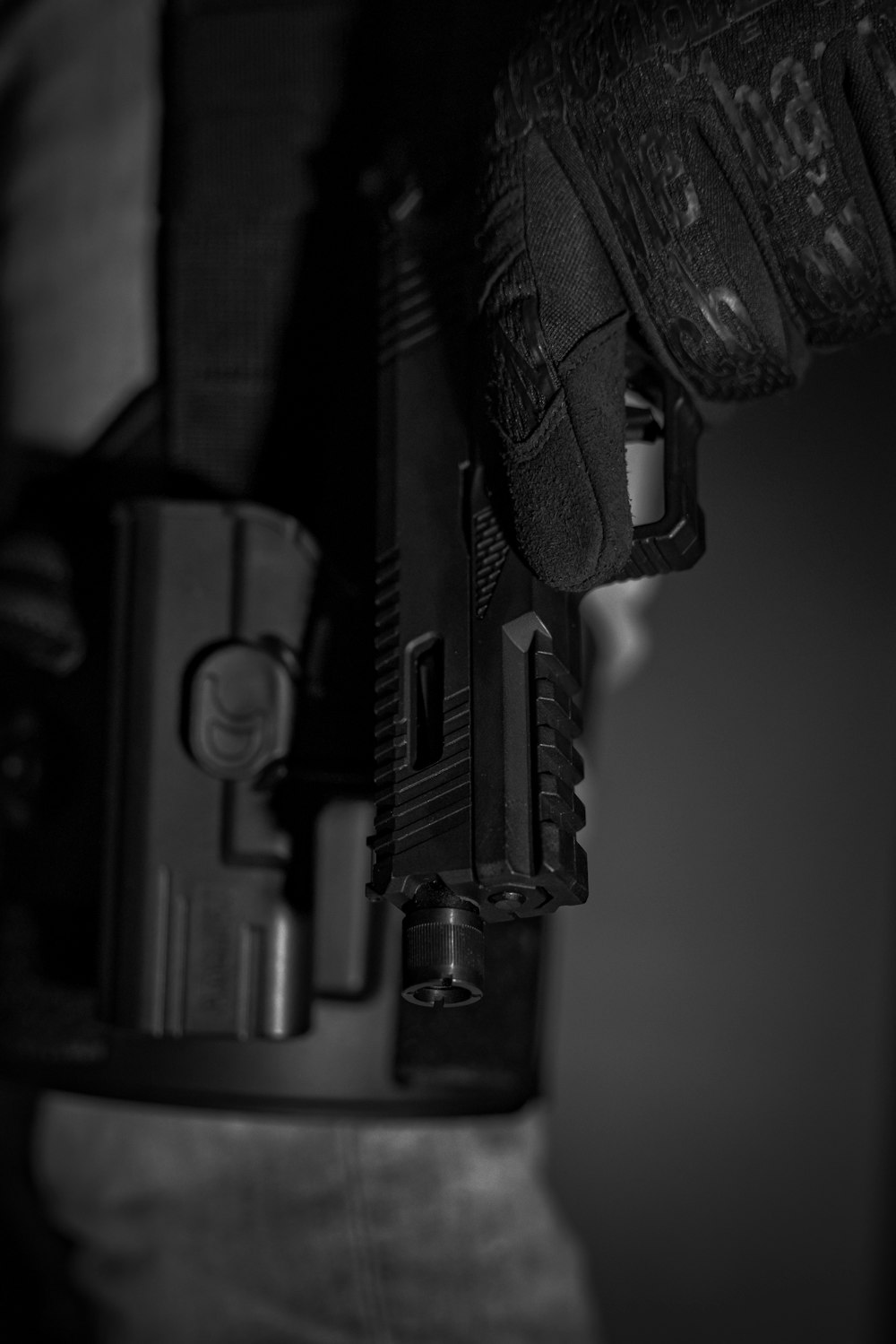 a close up of a person holding a gun