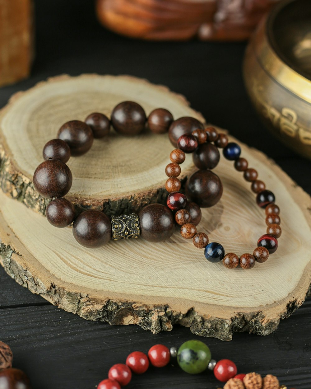 a couple of bracelets sitting on top of a wooden table