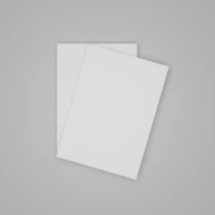 An overhead shot of several blank pages stacked neatly on a wooden desk.