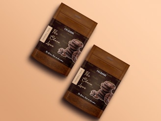 two bags of chocolate chips sitting on top of a table