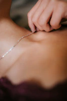 Detailed view of a repaired necklace alongside its digital tracking record.